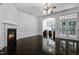 Spacious living room with french doors, fireplace and access to a bright office space at 140 Sunstone Dr, Cary, NC 27519