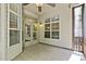 Relaxing covered patio boasts tile flooring, a ceiling fan, and views of the outdoors at 140 Sunstone Dr, Cary, NC 27519