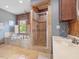 Bathroom featuring a tub with tile surround and glass enclosed shower at 1656 Nc-42 Hwy, Moncure, NC 27559