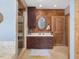Bathroom featuring a vanity, glass enclosed shower, tile floors, and wood walls at 1656 Nc-42 Hwy, Moncure, NC 27559