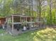 Spacious chicken coop with shaded area, ideal for raising chickens in a comfortable setting at 1656 Nc-42 Hwy, Moncure, NC 27559