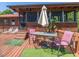 Outdoor deck with a dining set, lounge chairs, and a screened-in porch for relaxation and enjoyment at 1656 Nc-42 Hwy, Moncure, NC 27559