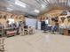 Spacious interior with mounted deer heads, workshop area, and a table with chairs at 1656 Nc-42 Hwy, Moncure, NC 27559