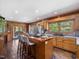 Open kitchen featuring wooden cabinets, stainless steel appliances, and a butcher block island at 1656 Nc-42 Hwy, Moncure, NC 27559