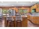 Open kitchen featuring wooden cabinets, stainless steel appliances, and a butcher block island at 1656 Nc-42 Hwy, Moncure, NC 27559