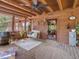 Covered porch area with seating and deck at 1656 Nc-42 Hwy, Moncure, NC 27559