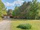 Expansive property with outbuildings, chicken coops, and a garage, ideal for rural living at 1656 Nc-42 Hwy, Moncure, NC 27559