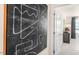 Hallway featuring a modern art piece and an open doorway to a well-lit room at 168 Holmes Corner Dr, Smithfield, NC 27577