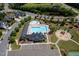 A captivating aerial view showcasing a pool, clubhouse, and parking, surrounded by mature trees and residential homes at 1719 Willowcrest Rd, Durham, NC 27703