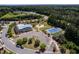 Aerial view of community amenities including pool, tennis court and playground at 1719 Willowcrest Rd, Durham, NC 27703