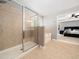 Bright bathroom featuring a tiled shower, soaking tub, and neutral color palette at 1719 Willowcrest Rd, Durham, NC 27703