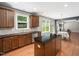 Open kitchen concept flows to a spacious living area with natural lighting at 1719 Willowcrest Rd, Durham, NC 27703
