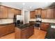 Well-equipped kitchen with an island, granite countertops, stainless appliances and ample cabinet space at 1719 Willowcrest Rd, Durham, NC 27703