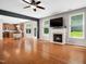 Spacious living room features a fireplace, hardwood floors, and plenty of natural light at 1719 Willowcrest Rd, Durham, NC 27703