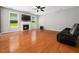 Comfortable living area featuring a fireplace, hardwood floors, and lots of natural light at 1719 Willowcrest Rd, Durham, NC 27703