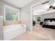 Main bath features a separate soaking tub, and doorway access to main bedroom at 1719 Willowcrest Rd, Durham, NC 27703