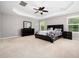 Serene main bedroom with tray ceilings, neutral decor, and plush carpeting for ultimate comfort at 1719 Willowcrest Rd, Durham, NC 27703