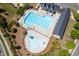 Aerial image shows a pool with a splash pad and plenty of seating at 1719 Willowcrest Rd, Durham, NC 27703