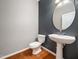 Elegant powder room with pedestal sink and modern fixtures, creating a stylish space at 1719 Willowcrest Rd, Durham, NC 27703