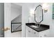 Bathroom shows a vanity and stairway to second floor at 1904 Victoria Rd, Raleigh, NC 27608