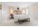 Bright bedroom with sitting area, neutral carpet, and natural light at 1904 Victoria Rd, Raleigh, NC 27608
