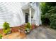 Inviting entrance with brick steps, black railings, and a well-manicured lawn at 1904 Victoria Rd, Raleigh, NC 27608