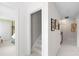 Well-lit upstairs hallway, showing doorways to bedrooms and neutral wall paint at 1904 Victoria Rd, Raleigh, NC 27608