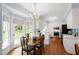 Kitchen with stainless appliances and view to the dining area and fenced backyard at 1904 Victoria Rd, Raleigh, NC 27608