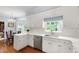 Bright kitchen featuring white cabinetry, stainless steel appliances, and eat-in area at 1904 Victoria Rd, Raleigh, NC 27608