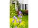 Beautiful purple flowers in the front garden enhance the home's curb appeal at 1904 Victoria Rd, Raleigh, NC 27608