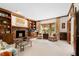 Inviting living room with a brick fireplace, wooden built-ins, and ample seating at 1904 Victoria Rd, Raleigh, NC 27608