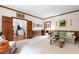 Spacious living room featuring wood paneling, stylish decor, and an open layout at 1904 Victoria Rd, Raleigh, NC 27608