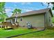 Exterior shot of the backyard deck featuring a propane tank for grilling in the green yard at 1980 Ferbow St, Creedmoor, NC 27522