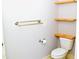 Bathroom includes a toilet, towel rack and open shelving at 1980 Ferbow St, Creedmoor, NC 27522