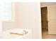 Bathroom tub with window view, plus a view into a closet at 1980 Ferbow St, Creedmoor, NC 27522