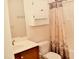Clean and well-lit bathroom featuring a vanity, toilet, and a shower with a curtain at 1980 Ferbow St, Creedmoor, NC 27522