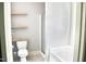 Bathroom with toilet, walk-in shower and tub plus open shelving at 1980 Ferbow St, Creedmoor, NC 27522
