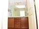 Bathroom vanity with mirror, plus a view into another room at 1980 Ferbow St, Creedmoor, NC 27522