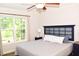 Bedroom features a bed, ceiling fan and a window view at 1980 Ferbow St, Creedmoor, NC 27522