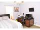 Comfortable bedroom featuring desk and chair near a bright window, next to the full sized bed at 1980 Ferbow St, Creedmoor, NC 27522