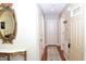 Welcoming hallway with a decorative mirror and console table leading to the front door at 1980 Ferbow St, Creedmoor, NC 27522