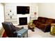 Comfortable living room with fireplace, built in shelving, and plush seating for relaxing at 1980 Ferbow St, Creedmoor, NC 27522