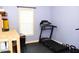 Dedicated workout area with a treadmill and weights for a convenient home gym at 1980 Ferbow St, Creedmoor, NC 27522