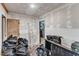 A glimpse of the unfinished basement showing exposed walls, unpainted sheetrock and stored belongings at 2010 Summerdale Dr, Raleigh, NC 27604