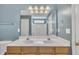 Bathroom featuring a double vanity, blue walls, and a walk-in shower at 2037 Summer Shire Way, Raleigh, NC 27604
