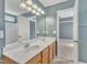 Bathroom featuring a double vanity, walk-in shower and grey paint at 2037 Summer Shire Way, Raleigh, NC 27604