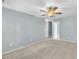 Spacious bedroom with carpeted floors, ceiling fan, and doorway, offering a comfortable living space at 2037 Summer Shire Way, Raleigh, NC 27604