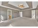 Large main bedroom featuring a tray ceiling and ensuite bath at 2037 Summer Shire Way, Raleigh, NC 27604