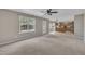Inviting living room featuring neutral walls and carpet flooring and access to the kitchen, creating an open and airy space at 2037 Summer Shire Way, Raleigh, NC 27604