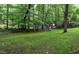 Backyard featuring a playful swing set and a handy storage shed for outdoor fun at 205 Bruton Dr, Chapel Hill, NC 27516